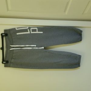 Victoria's secret grey with white writing joggers.
